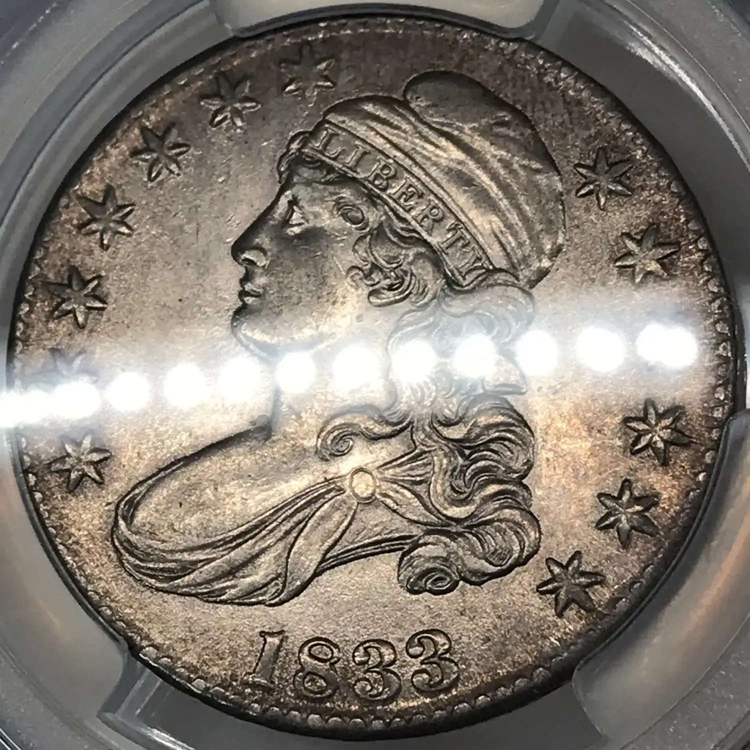 1833 Capped Bust Lettered Edge Half Dollar PCGS Genuine - AU